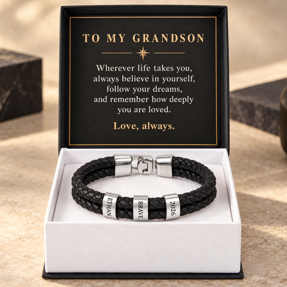 Silver-finish personalized bracelet with three engraved rings in a standard gift box and To My Grandson message card.
