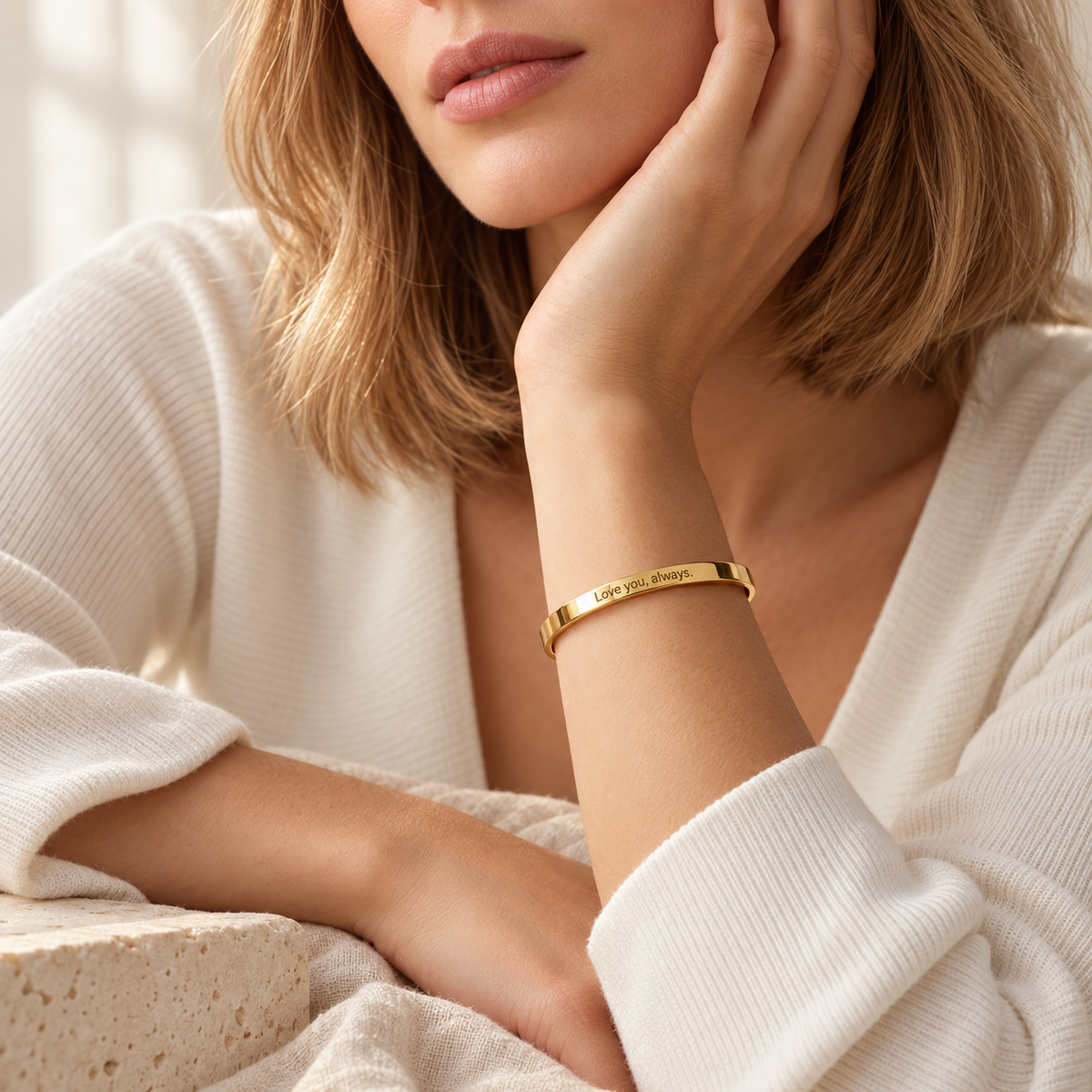Woman wearing a personalized gold cuff bracelet