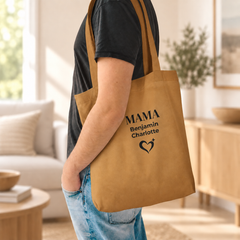 Woman holding coffee and carrying a personalized camel Mama tote bag