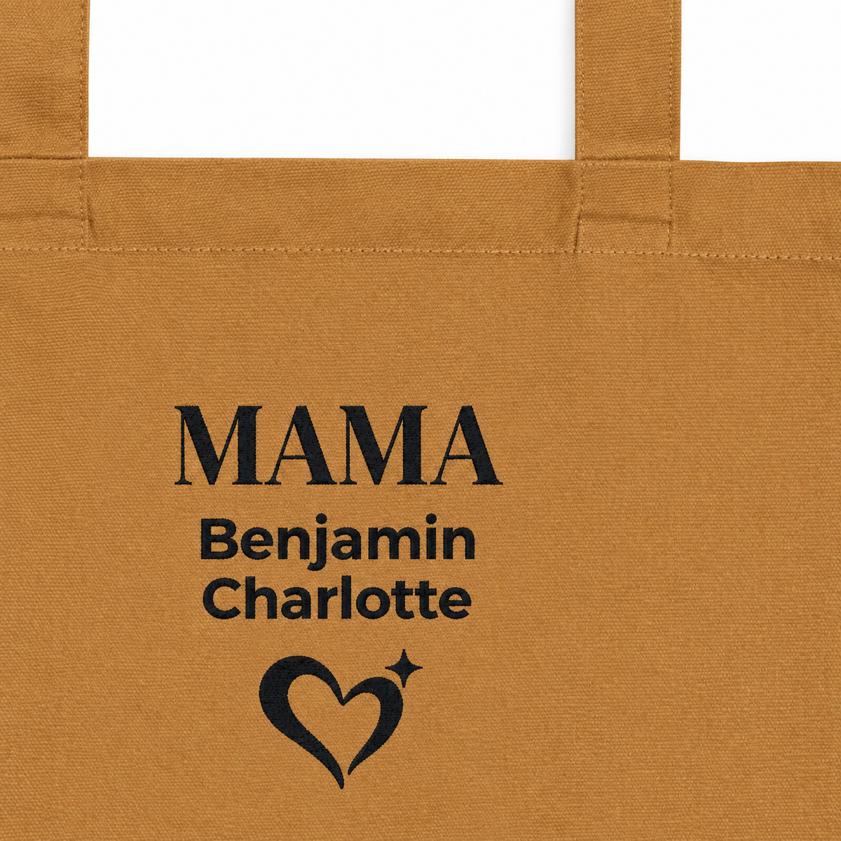 Close-up of black “MAMA,” children’s names and heart design on a camel tote bag