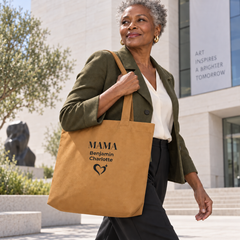 Stylish woman carrying a personalized camel Mama tote bag outdoors