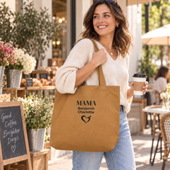 Woman carrying a personalized camel Mama tote bag with children’s names