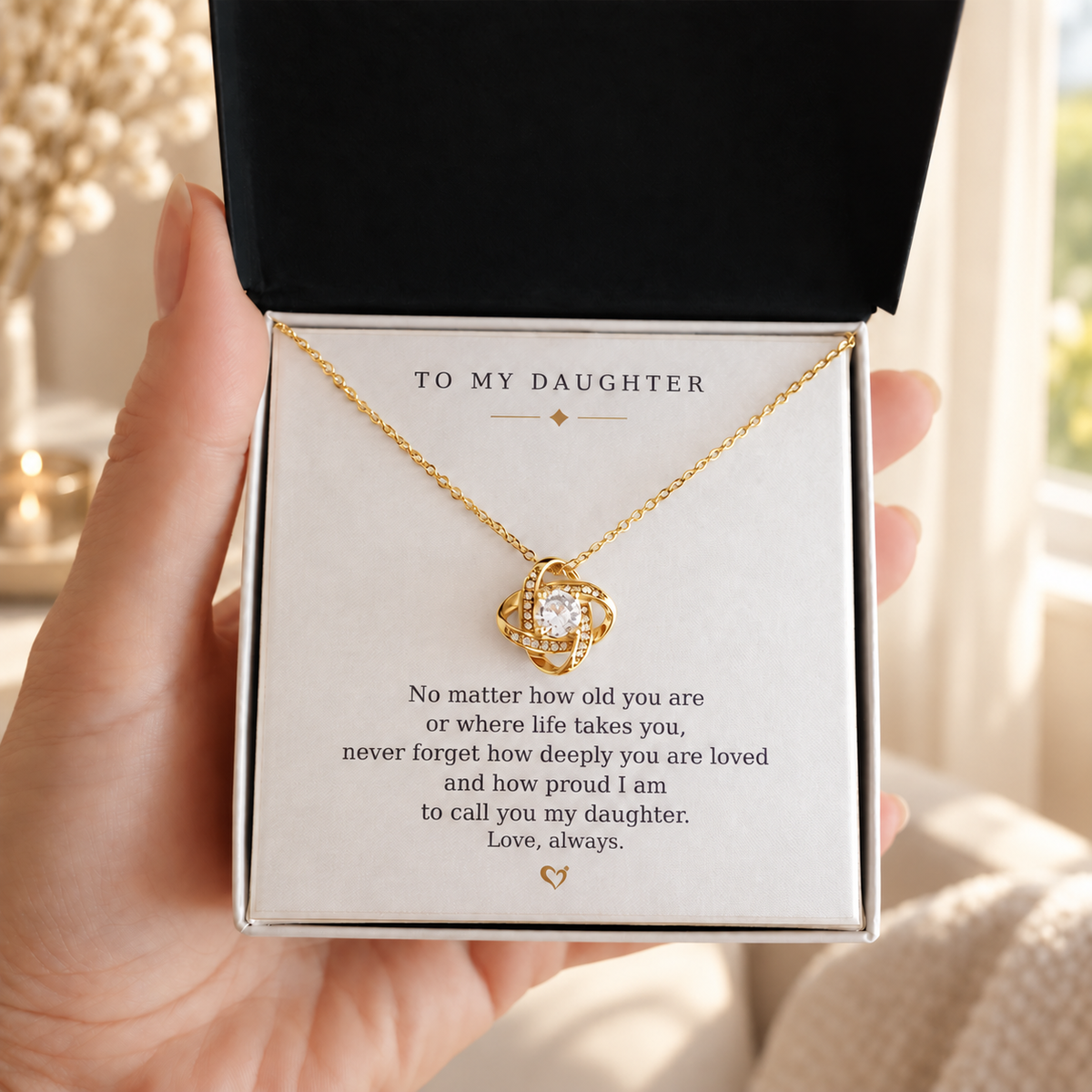 Gold Love Knot necklace and daughter message card presented in an open gift box