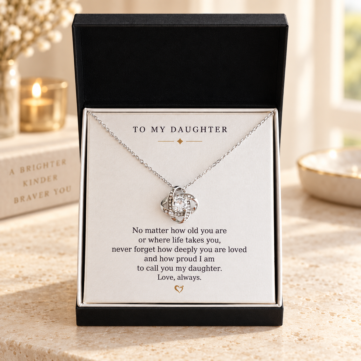 Silver Love Knot necklace in a standard gift box with a heartfelt daughter message card
