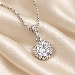 Close-up of the Eternal Hope cubic zirconia pendant on ivory satin
