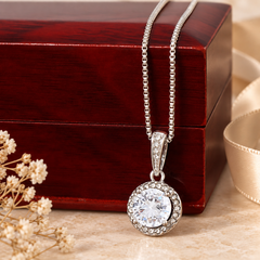 Eternal Hope necklace displayed with the mahogany-style luxury gift box